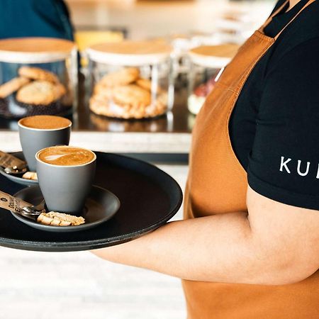 Pullman Auckland Airport Hotel Екстериор снимка A server holding a tray of coffee